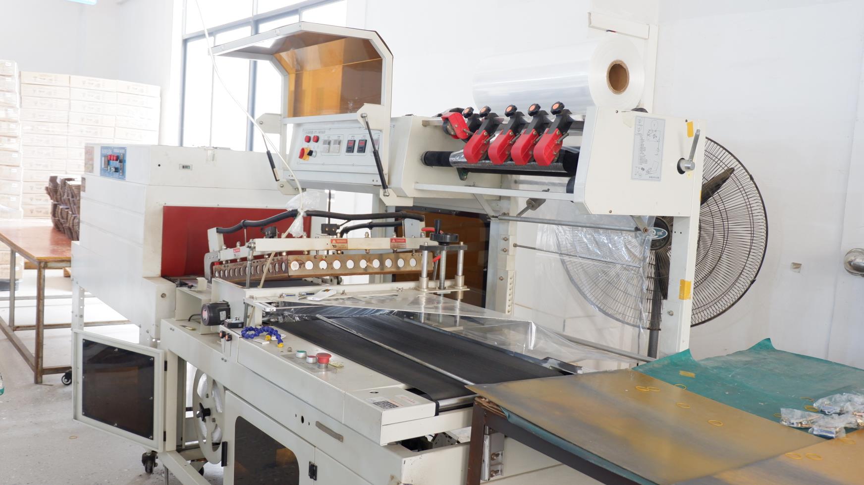 Heat shrinking machine for LED lamp cable and component finishing at NexLt