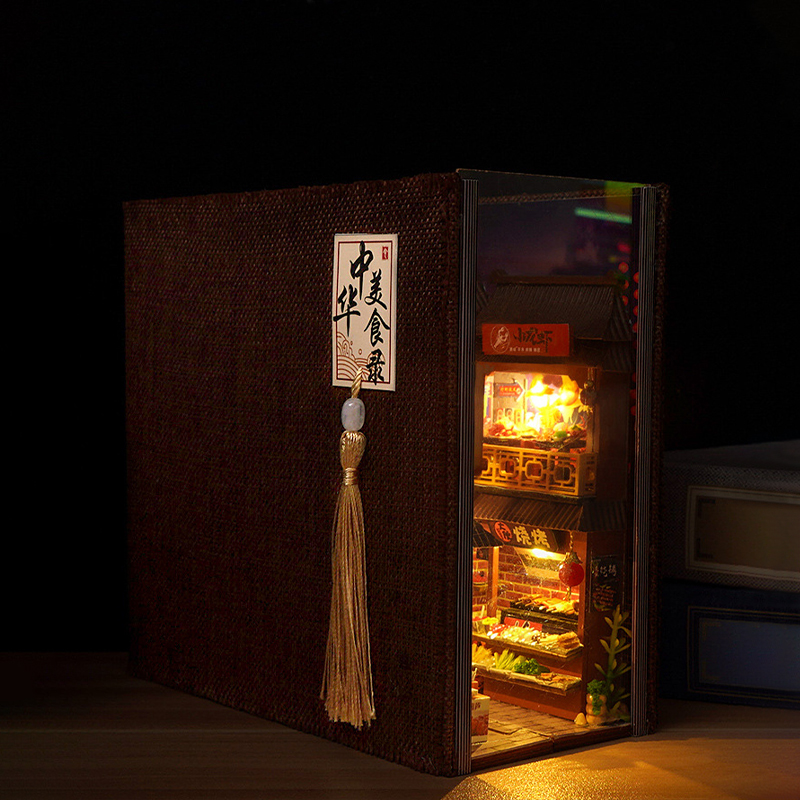 Miniature book nook opened revealing tiny world inside