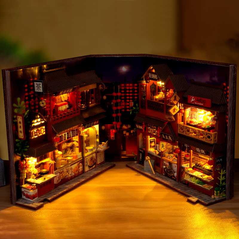 Miniature scene with warm LED glow and layered storefront details