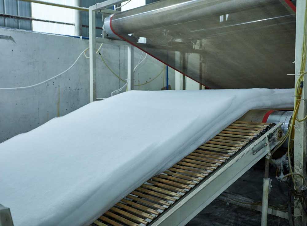 LJF air filter production step 3 - Carding and preparing filter media