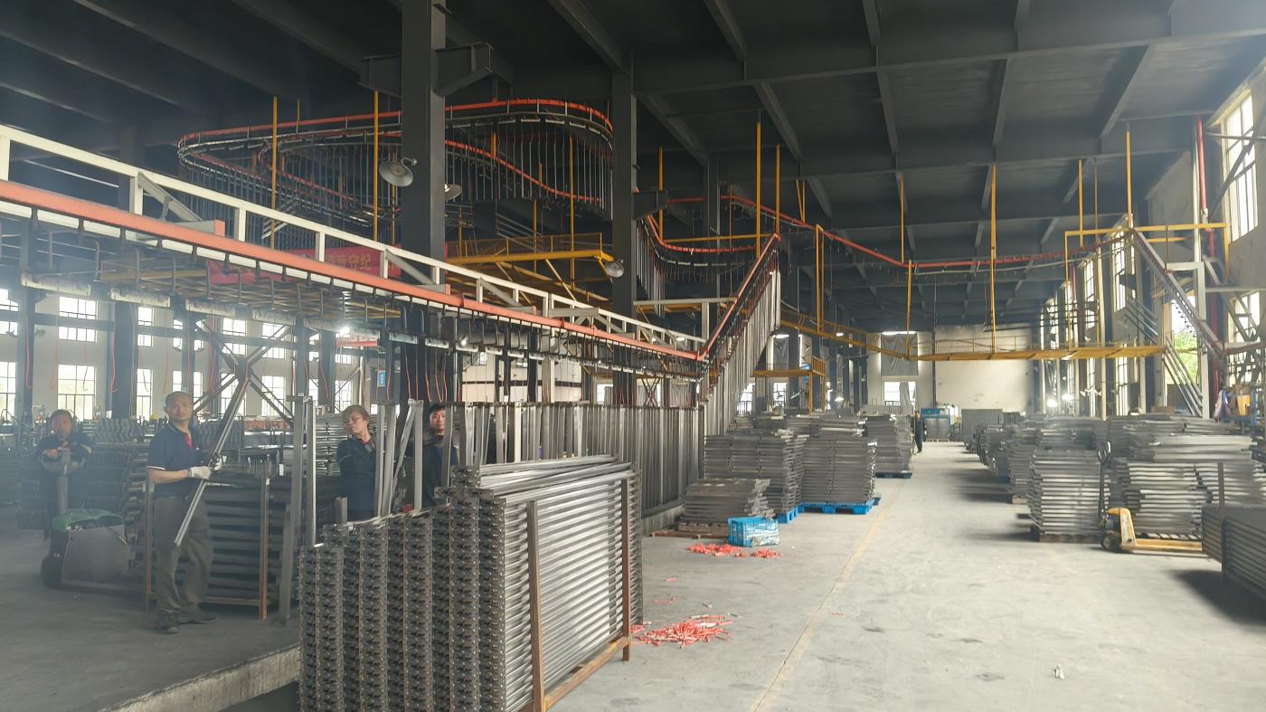 Automated spray painting line for racking surface treatment