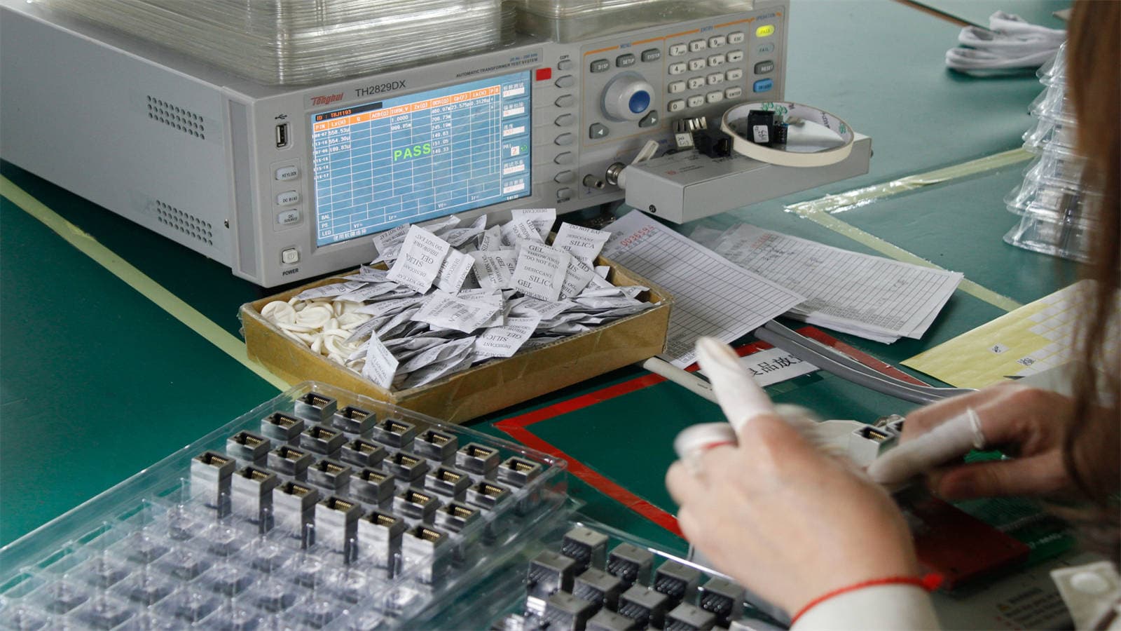Integrated testing of assembled optical transceiver modules
