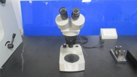 Microscope for micro-level quality inspection of motor components at Luv Motors