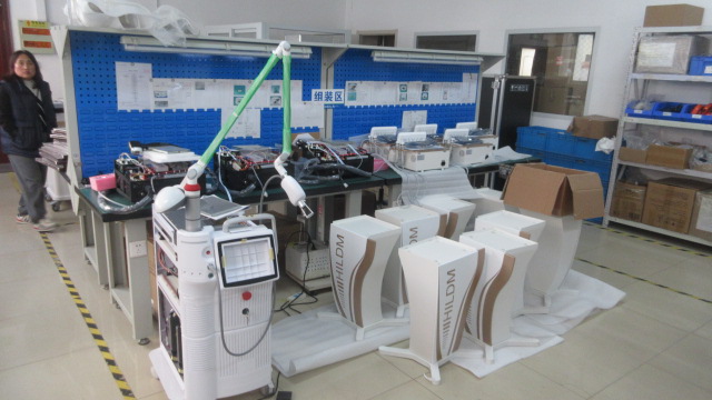 Lyens Beauty main assembly line with workers producing beauty salon equipment