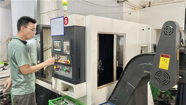 MecMill Precision quality control team inspecting CNC machined components