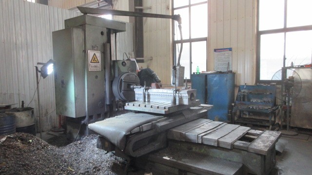 5-axis CNC milling machine performing complex precision machining operations