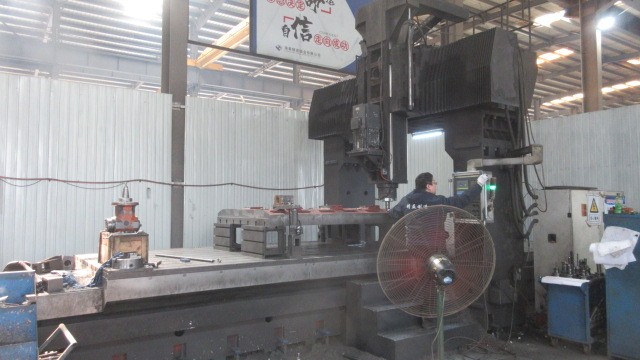 Precision CNC milling operation on aluminum workpiece in MecMill workshop