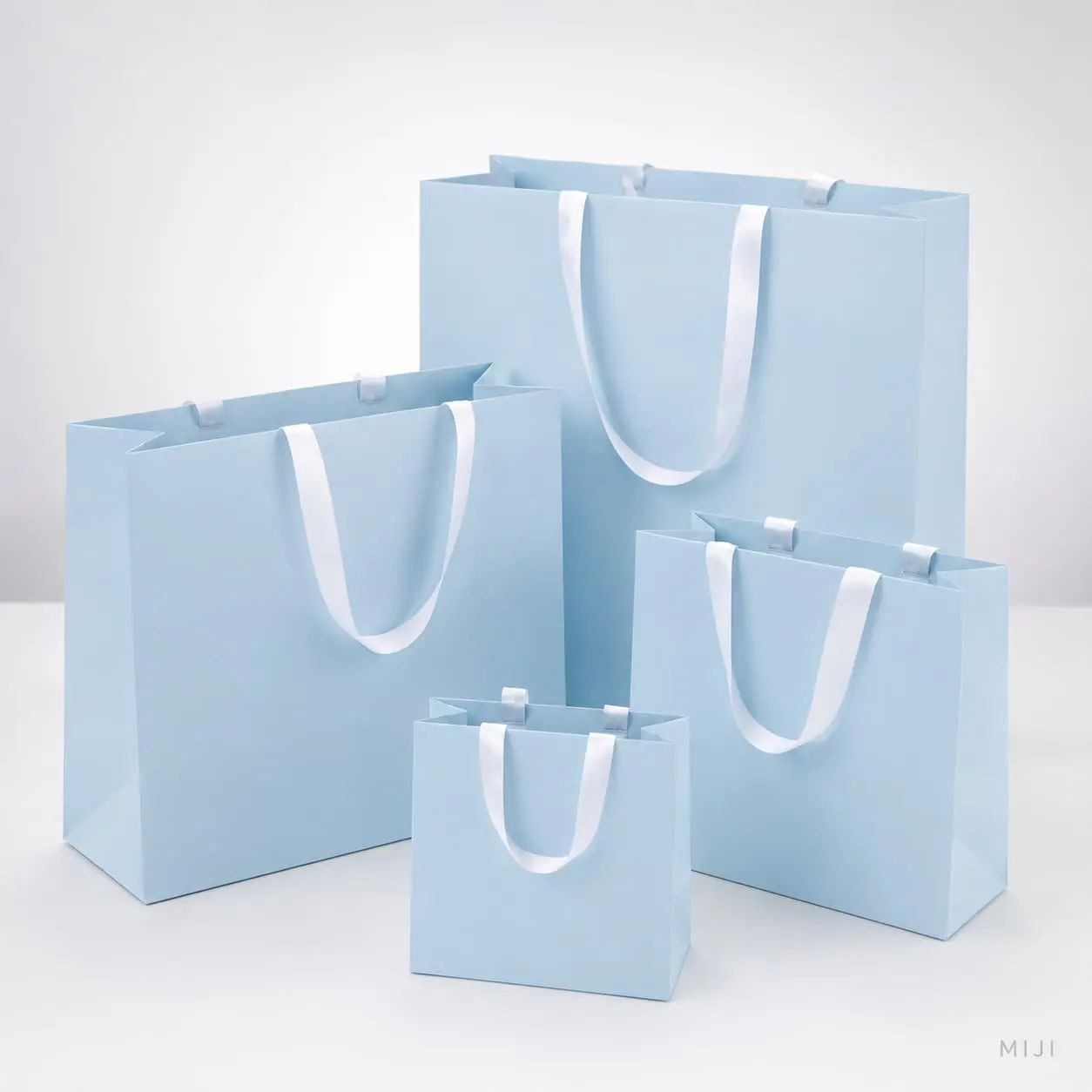 China Custom Light Blue Paper Gift Bags with White Ribbon Handles Manufacturers, Suppliers
