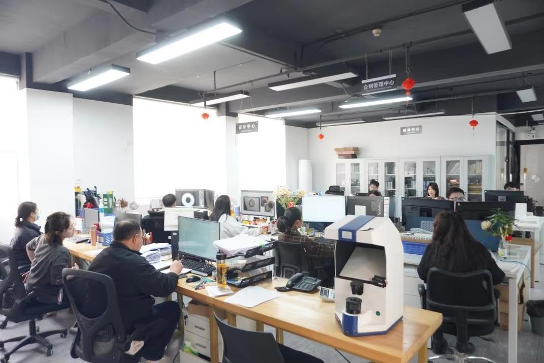 Mio Lenses factory interior — optical lens production floor and precision manufacturing equipment