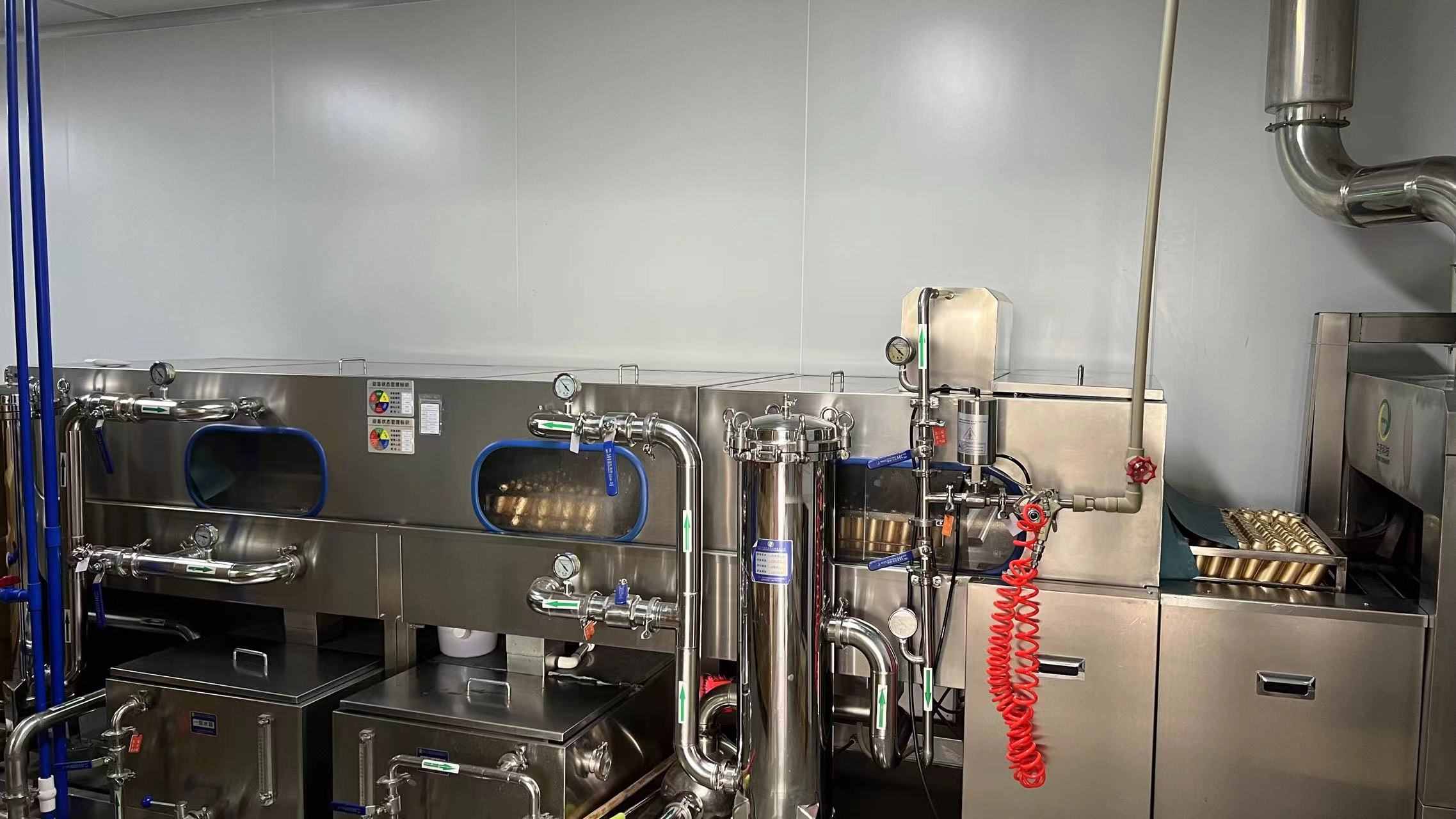 Automated bottle washing machine for cosmetics container sterilization at Miura Beauty