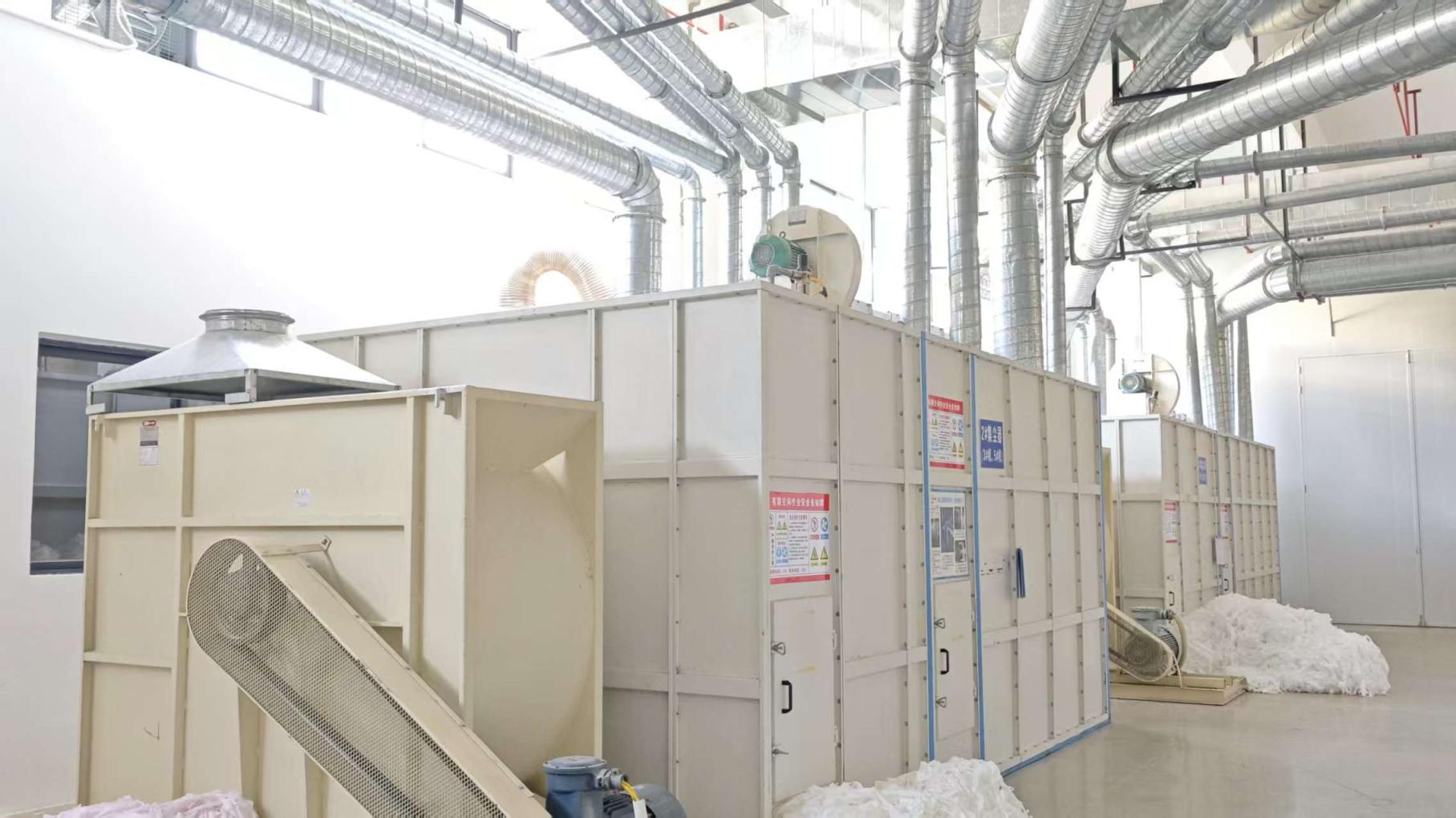 Máquina industrial de recolección de polvo en fábrica Movigo Health