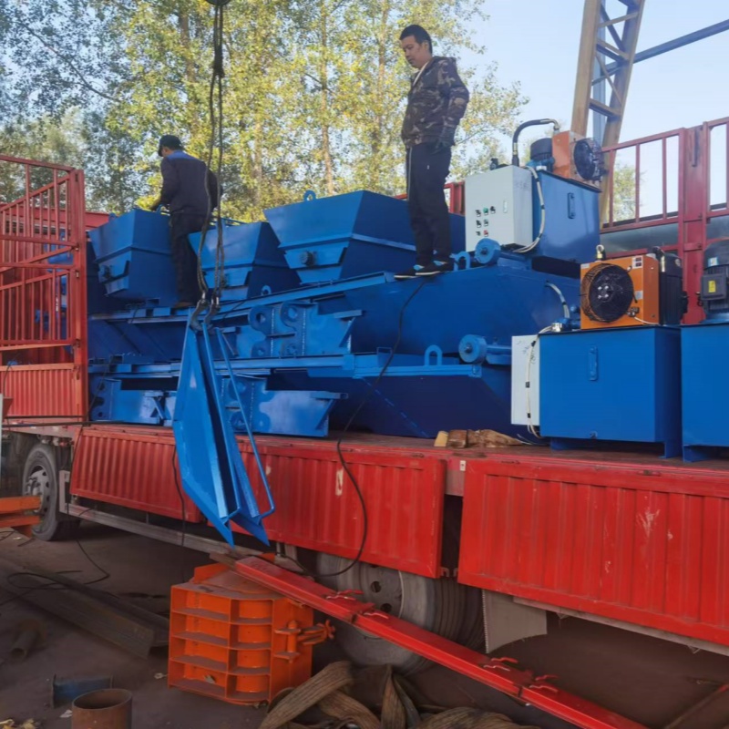 Excavator shaping concrete U groove