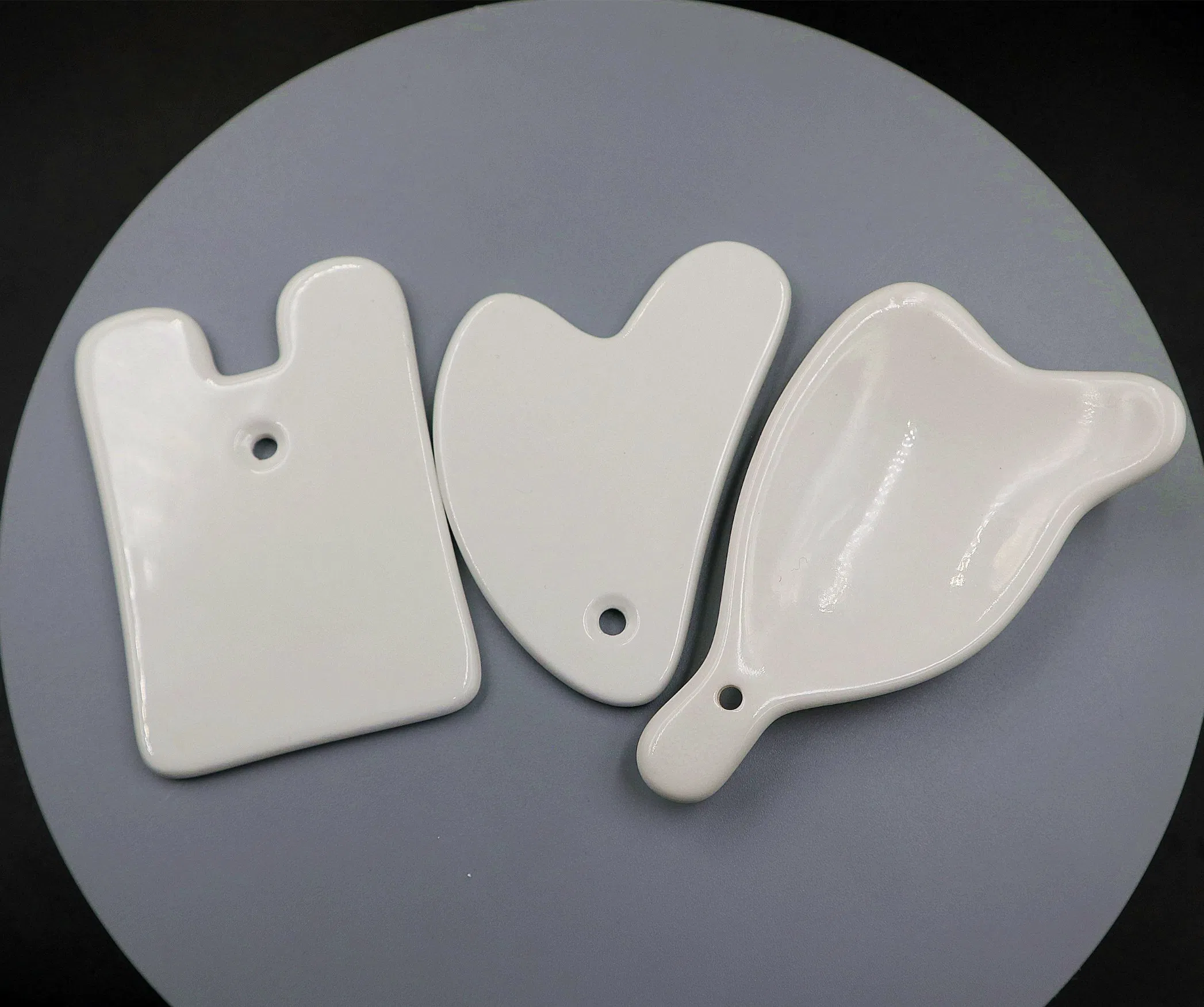 Herramienta de masaje Gua Sha de cerámica de alta calidad que promueve la circulación para el cuerpo