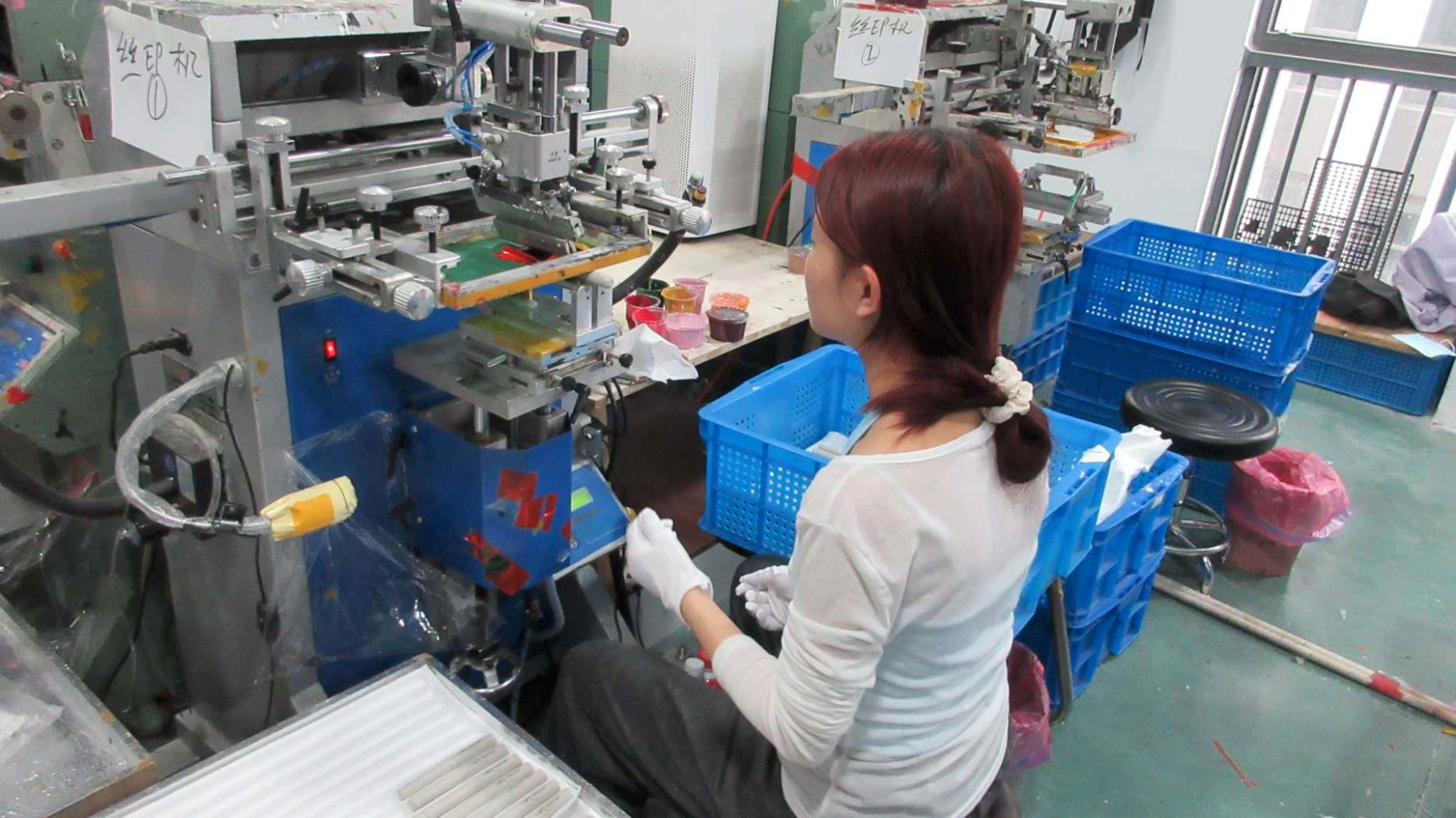 Industrial printing machine for cosmetic packaging at Nebula Beauty