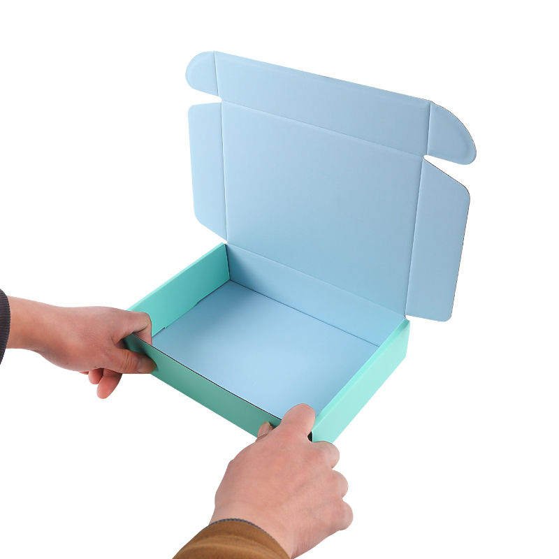 Wholesale Hard Blue Cardboard Paper Mailing Apparel Box Portable Custom Logo Printed Corrugated Shipping Cosmetic Box