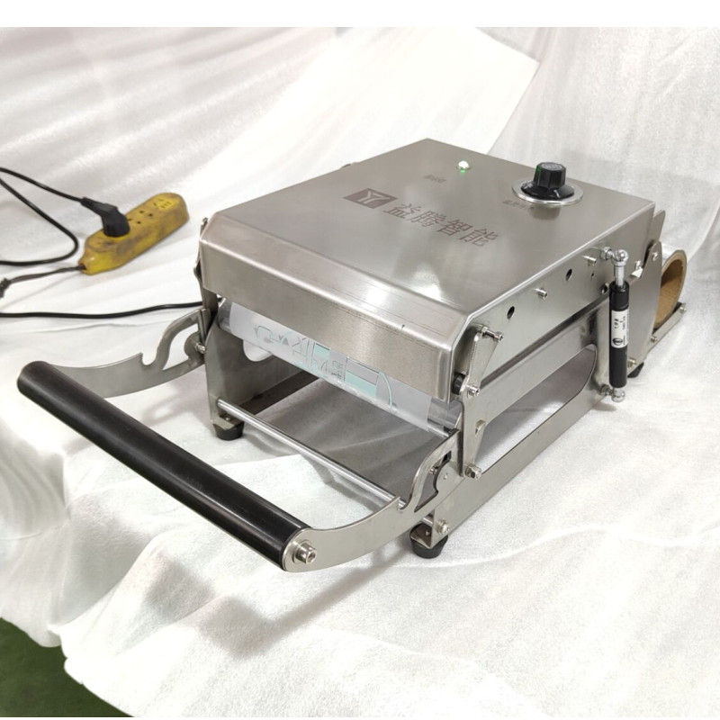 Right elevation view of manual tray sealer