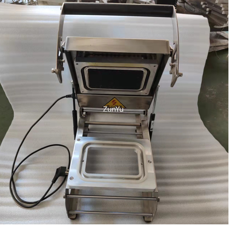 Front elevation view of manual tray sealer