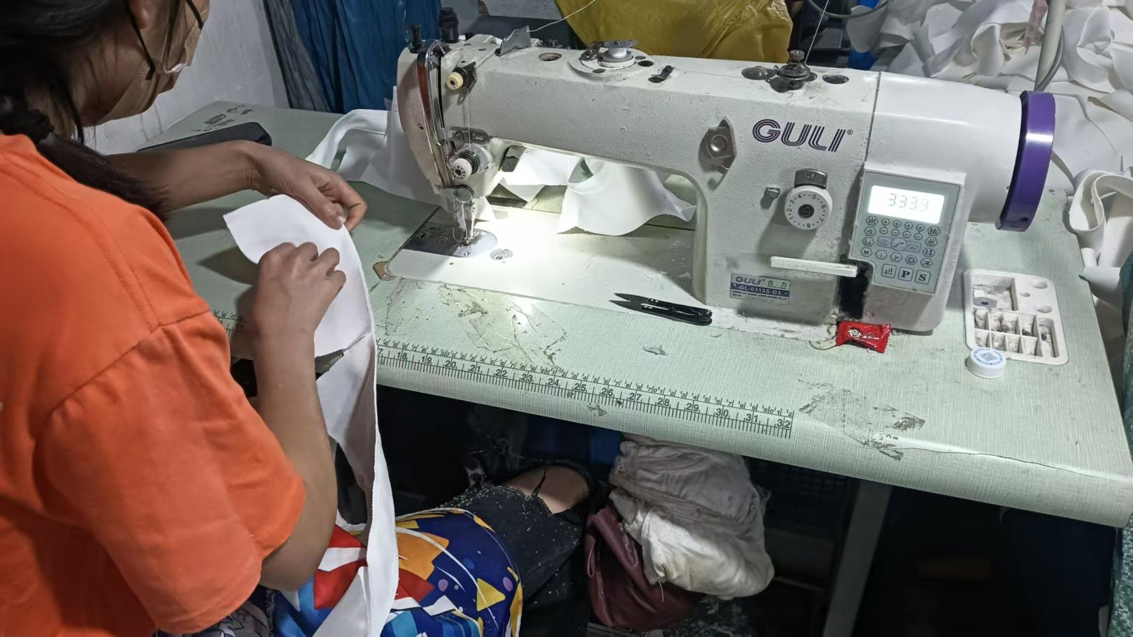 Industrial sewing machine for brush bag manufacturing at NTC Beauty factory