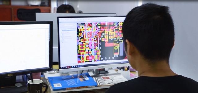 Ocent Monitor modern manufacturing facility interior with advanced production equipment