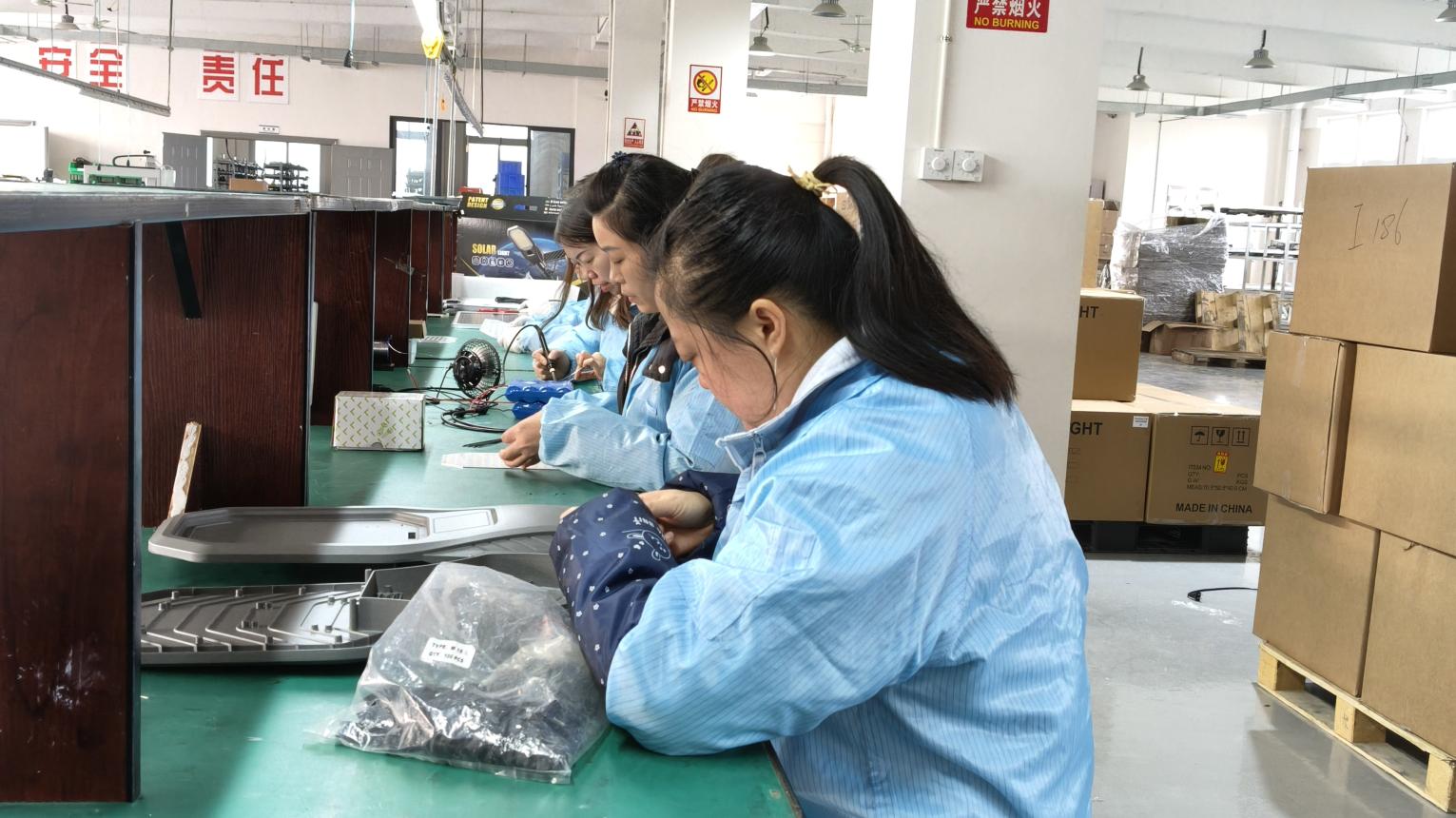 Assembly line for outdoor LED lighting fixtures