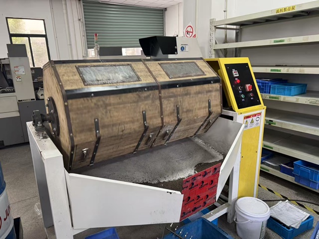 Surface grinding machine used for precision surface finishing of orthopedic implant components