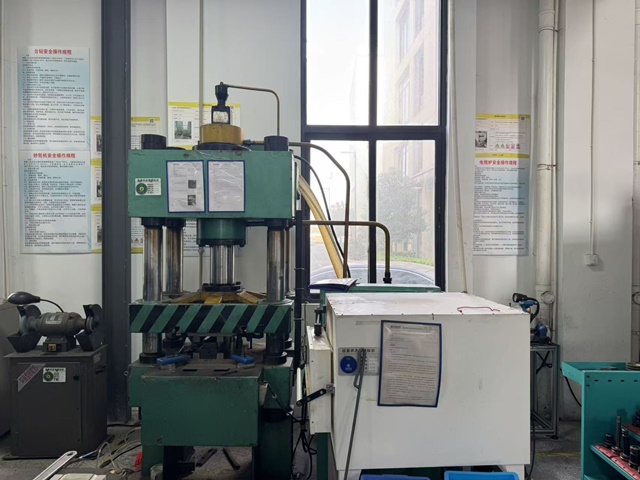 Precision stamping machine for forming orthopedic plate and implant components from medical-grade sheet metal