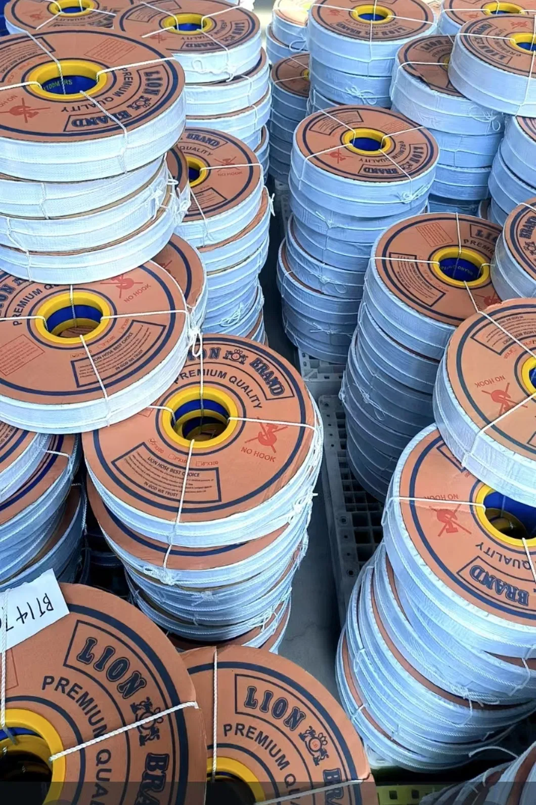 Packaged PVC Hose Rolls in Warehouse