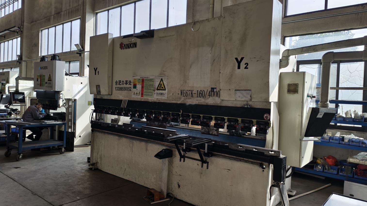 Industrial bending machine at Phlox Energy factory