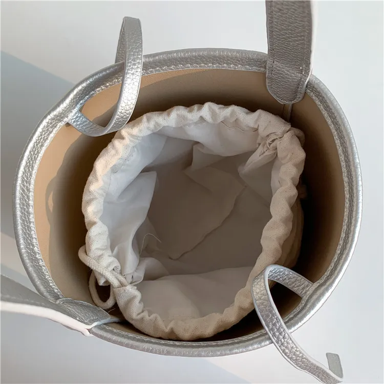 Bolso de mano femenino de gran capacidad, textura, bolso cilíndrico para el brazo, diseño de nicho suave de PU, bolso de cuero abrasivo tipo cubo