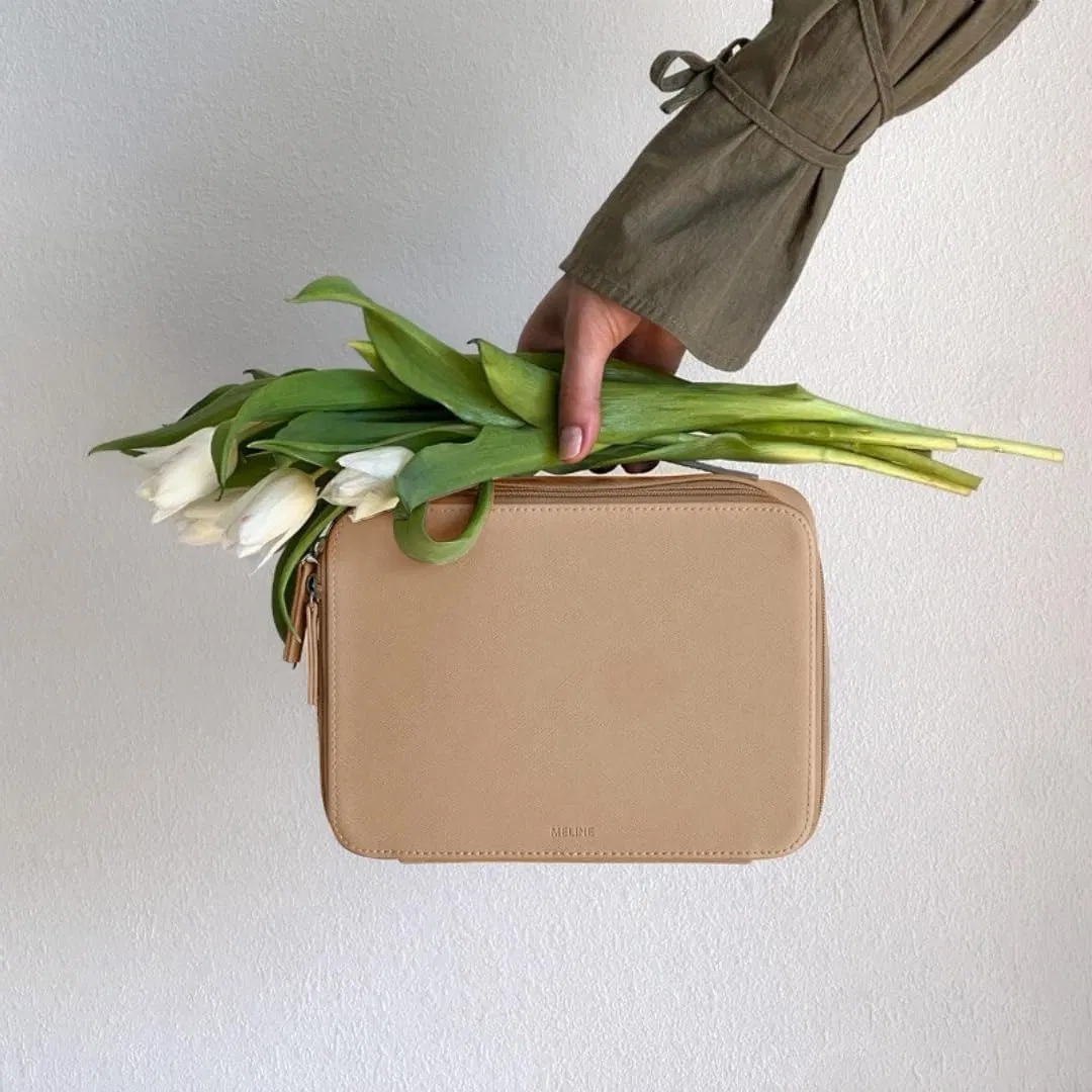 Bolsa de aseo de cuero duradero con asa conveniente para un transporte fácil