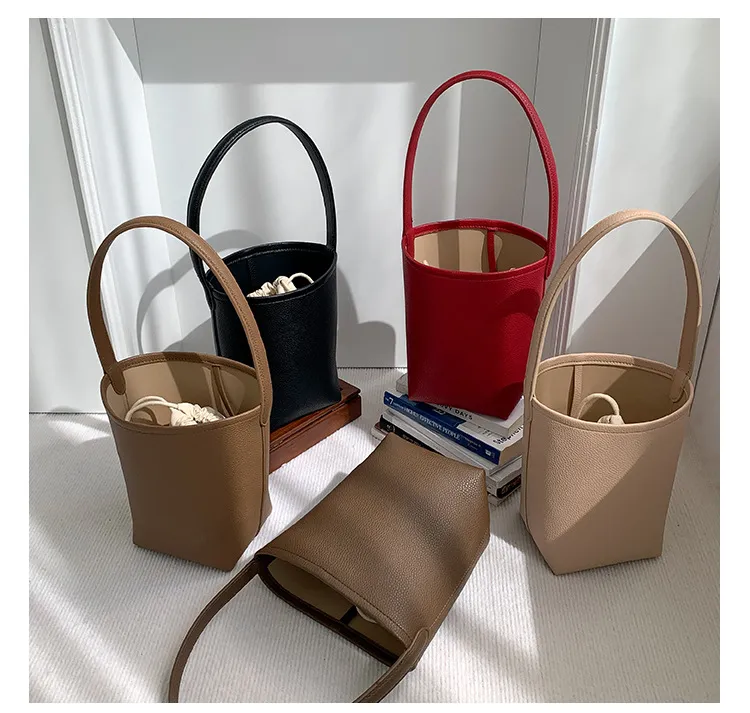 Bolso de mano femenino de gran capacidad, textura, bolso cilíndrico para el brazo, diseño de nicho suave de PU, bolso de cuero abrasivo tipo cubo