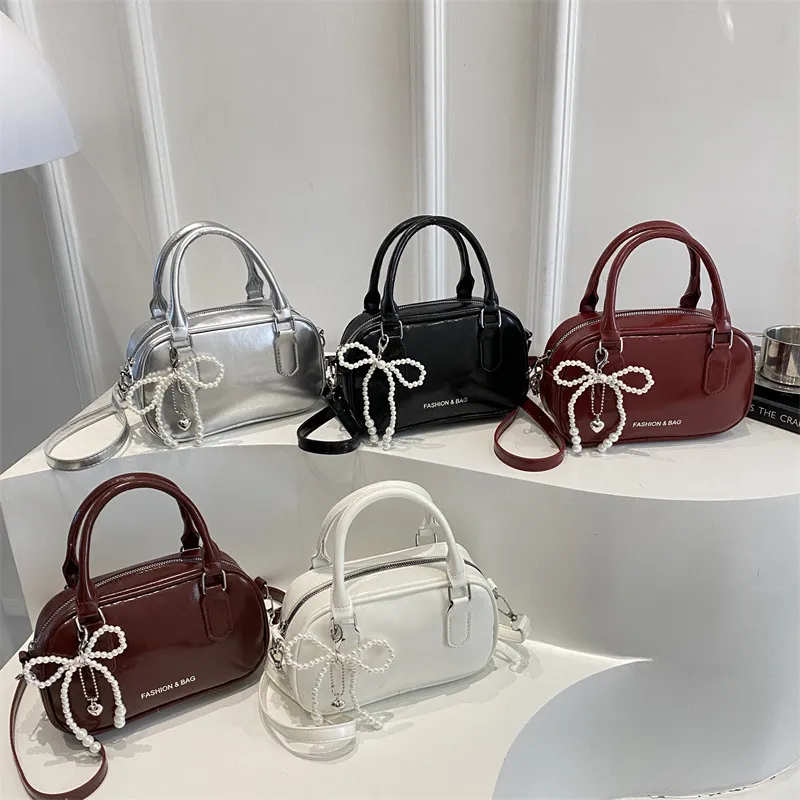 Bolsa de cubo de doble cremallera estilo coreano al por mayor para mujeres, 2026 nuevo estilo de verano, bolsa de hombro de lujo ligero, bolsa cruzada de cadena de moda