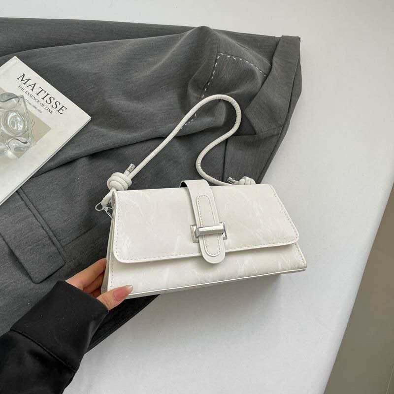 Bolso de hombro de PU texturizado con asa anudada y hebilla de metal, bolso pequeño