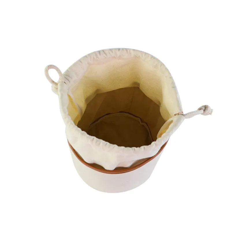 Bolsa organizadora de maquillaje de viaje con forma de barril y cordón
