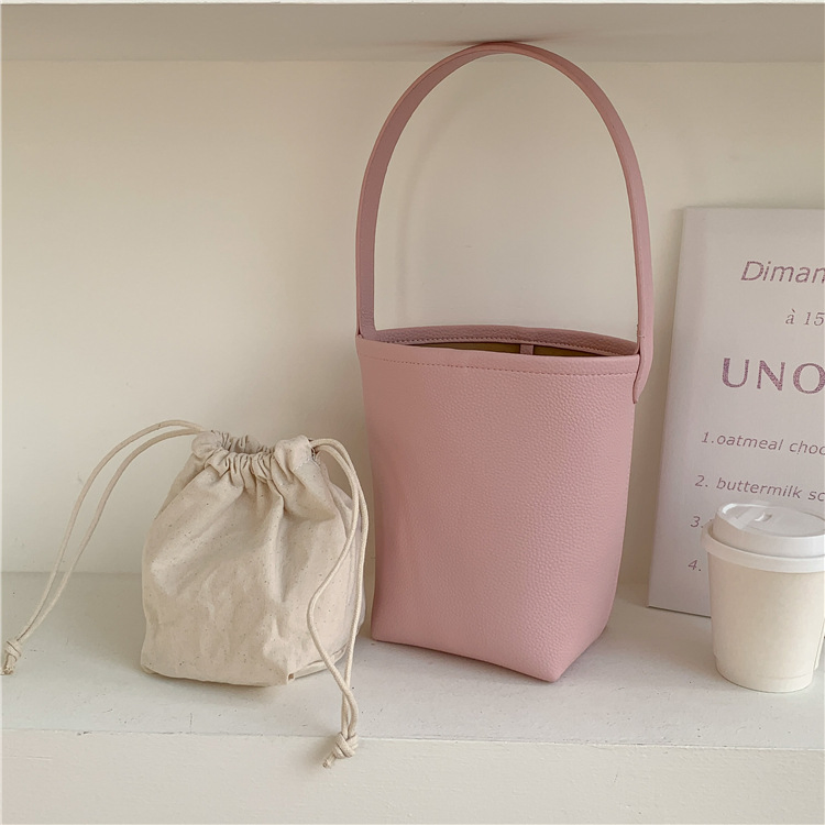 Bolso de mano femenino de gran capacidad, textura, bolso cilíndrico para el brazo, diseño de nicho suave de PU, bolso de cuero abrasivo tipo cubo
