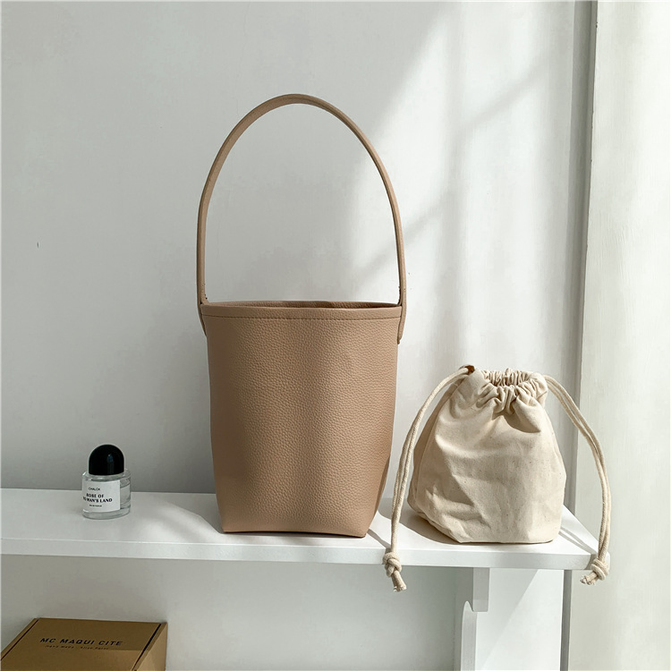 Bolso de mano femenino de gran capacidad, textura, bolso cilíndrico para el brazo, diseño de nicho suave de PU, bolso de cuero abrasivo tipo cubo