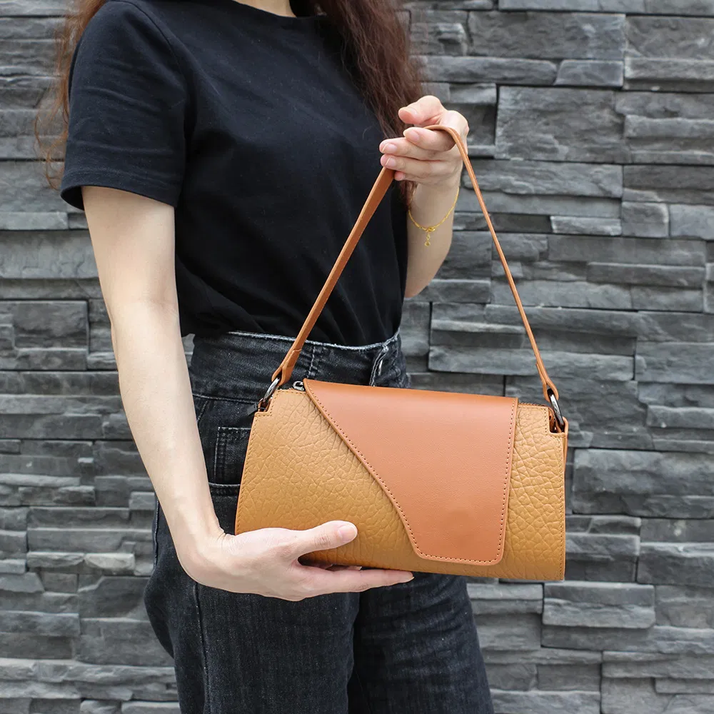 2026 Bolsa baguette de cuero negro minimalista con solapa asimétrica, bolso de hombro para uso diario