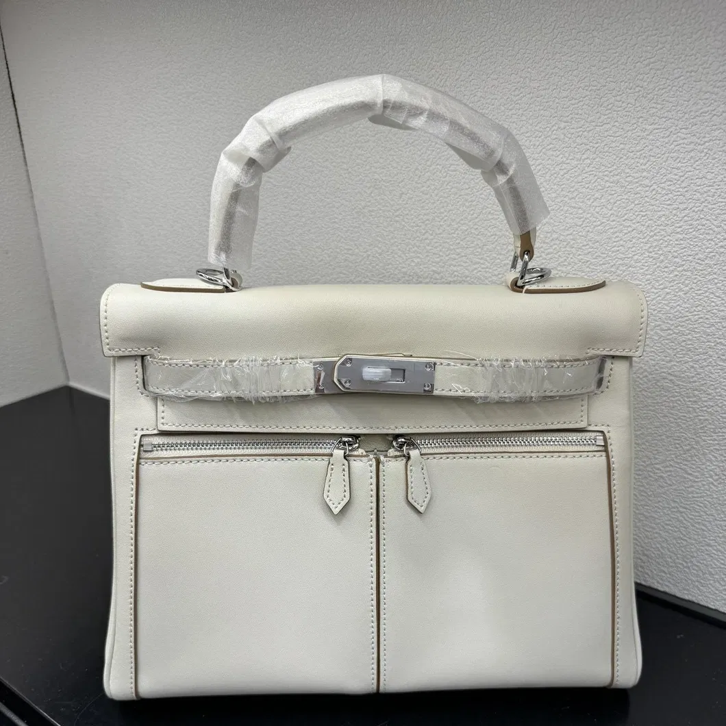 2025 Nueva bolsa de cesta de verduras de piel de vaca con grano de lichi, versión coreana del estilo minimalista, bolso casual tipo cubo para mujeres