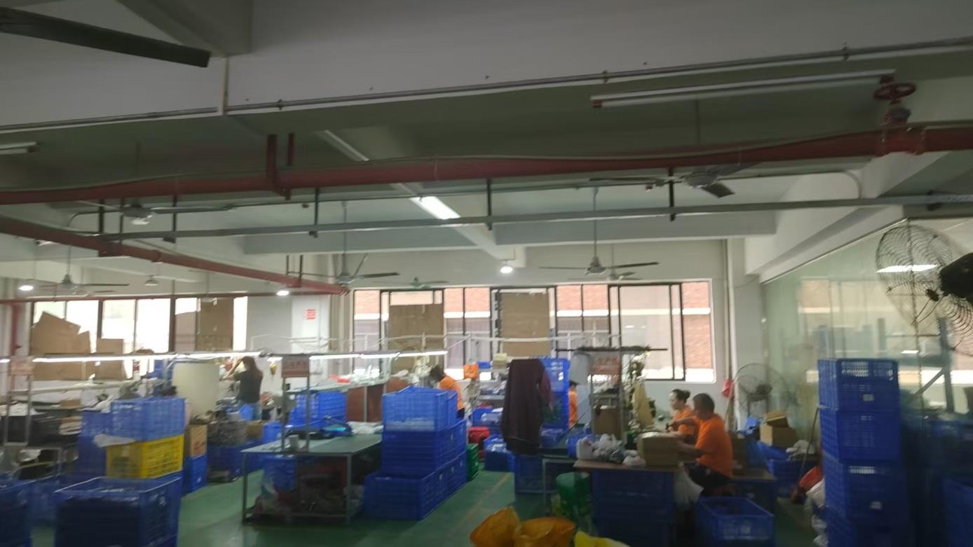 LED fixture assembly line at Pina Light — precision component installation and soldering