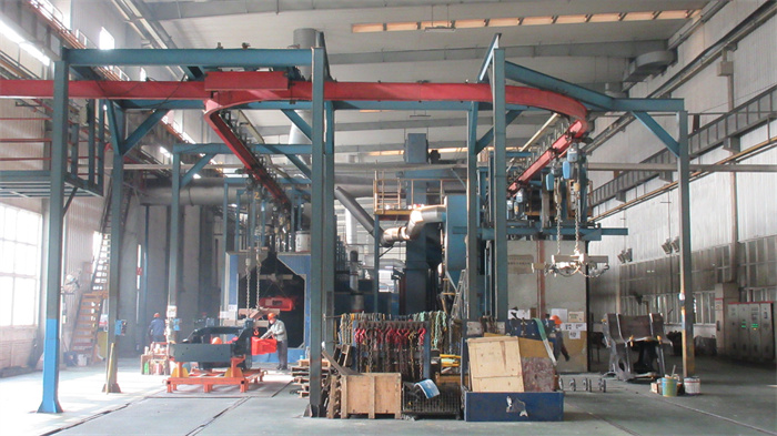 Final painting — quality surface treatment and painting of finished construction machinery