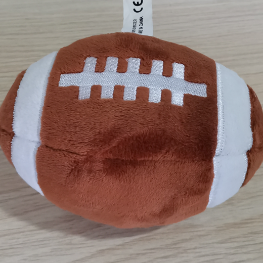 Pelota de juguete interactiva para perros en forma de fútbol americano de peluche lindo con sonido