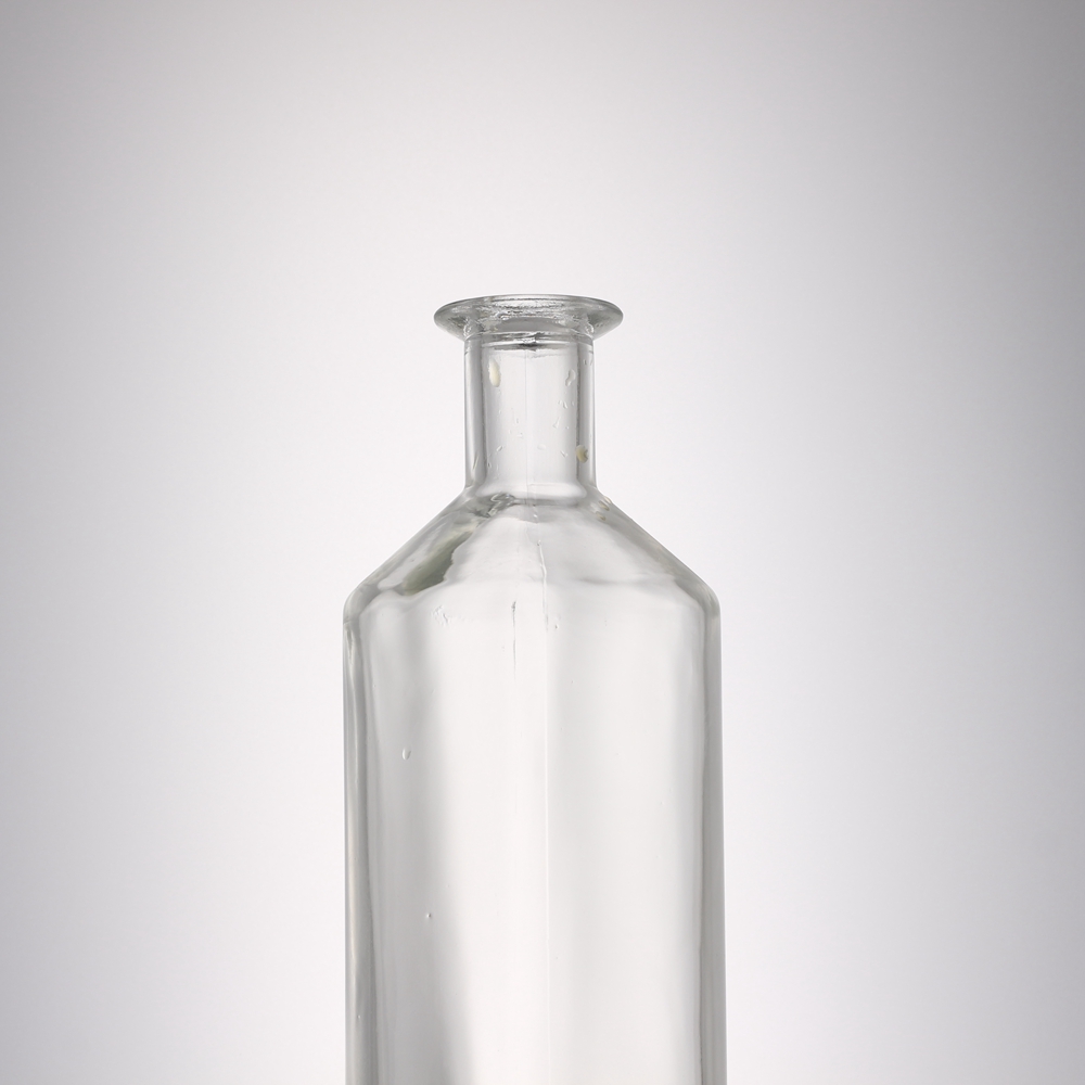 China 700 ml round liquor glass bottle with stopper cork Manufacturer, Manufacturers