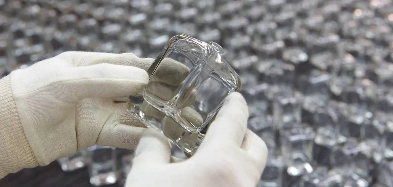 QLT ProGlass manufacturing facility — integrated glass bottle production from raw materials to finished goods