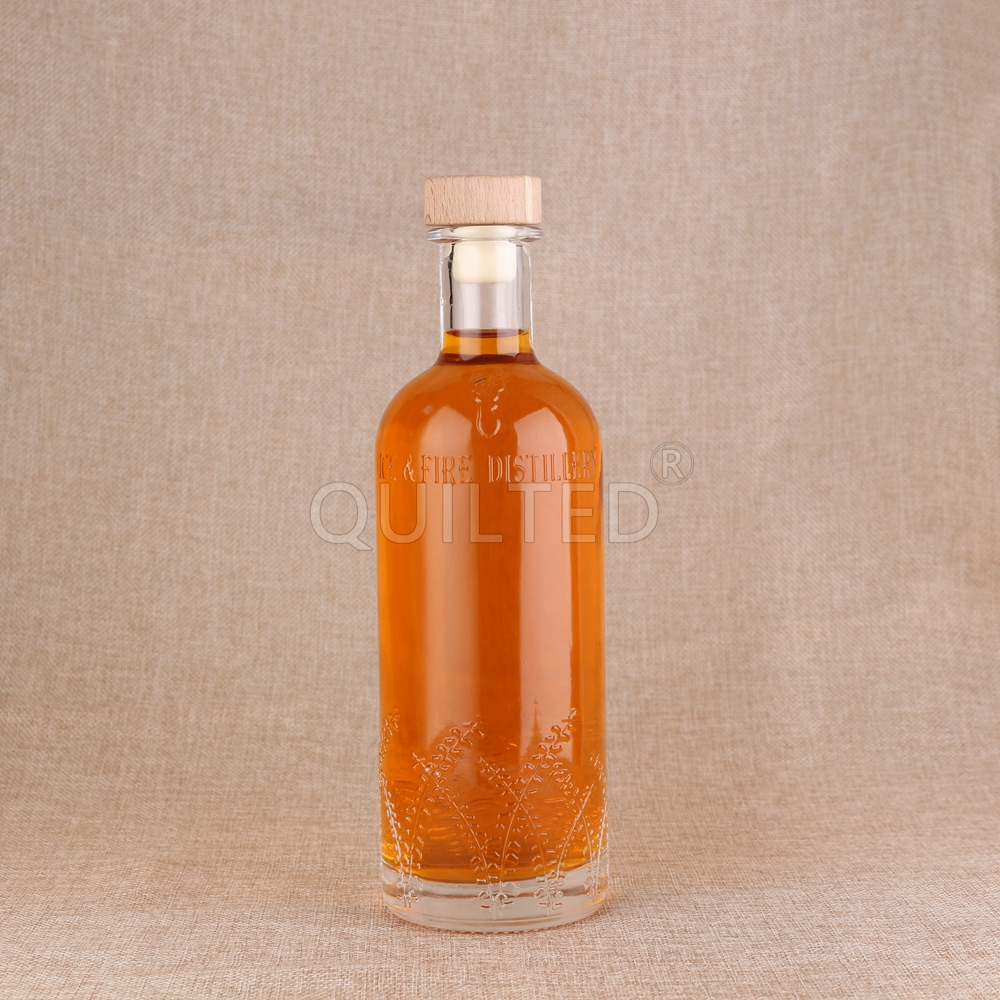 Wholesale 700ml embossed glass liquor bottle with cork  Supplier, Suppliers