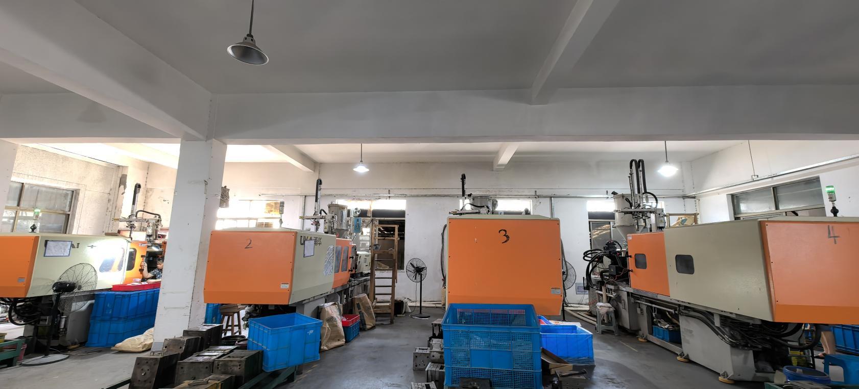 Injection molding machine for lamp component production at Quack Lamp