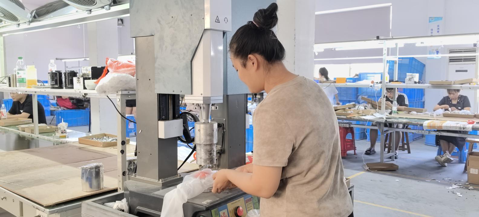 Ultrasonic welding machine for lamp housing assembly at Quack Lamp