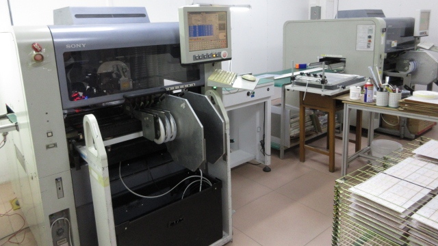 SMT machine for PCB assembly at Quack Lamp manufacturing facility