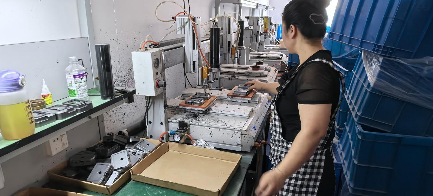 Automatic dispensing machine for precision adhesive application at Quack Lamp