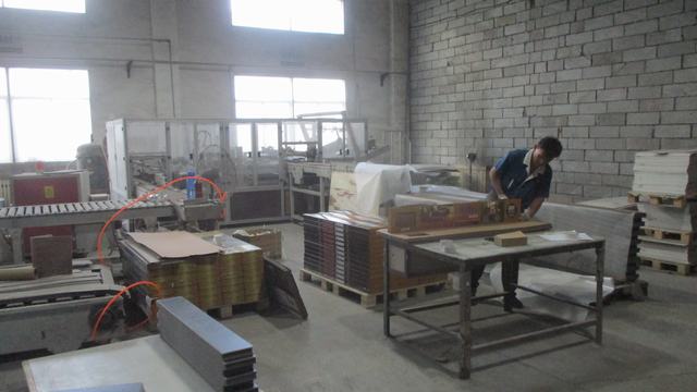 Final packaging of WPC flooring products for global distribution