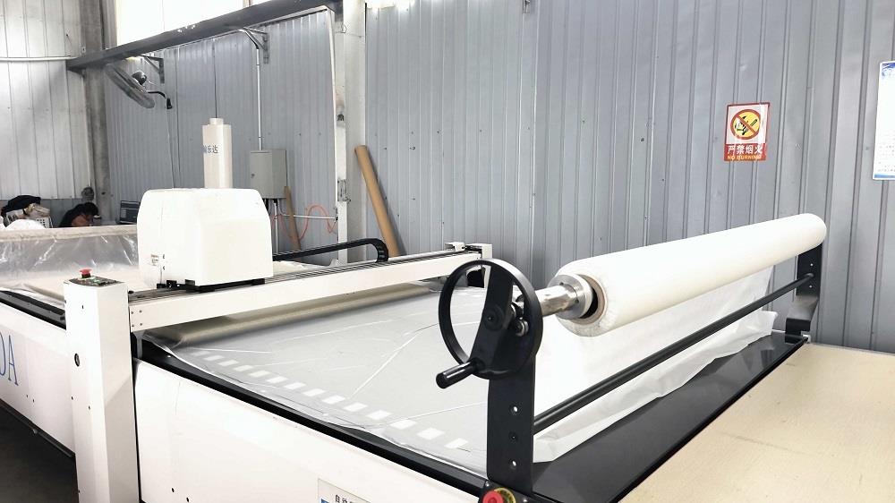 Automatic CNC cutting machine for shoe components at Lento facility